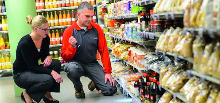 rentokil-technician-in-supermarket-inspecting-with-customer