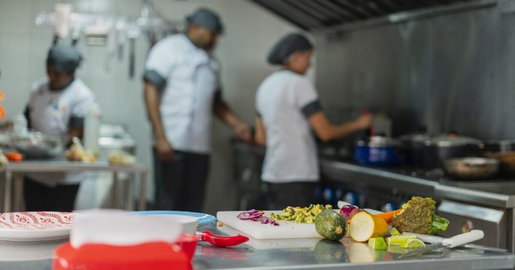 commercial-kitchen-with-food-waiting-to-b-prepared-potentially-attracting-flies