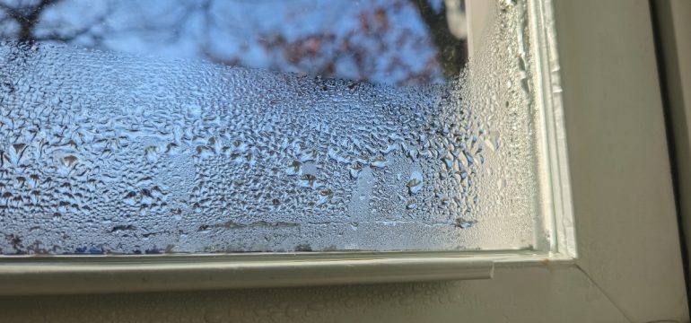 property-care-condensation-droplets-at-base-of-white-window-frame